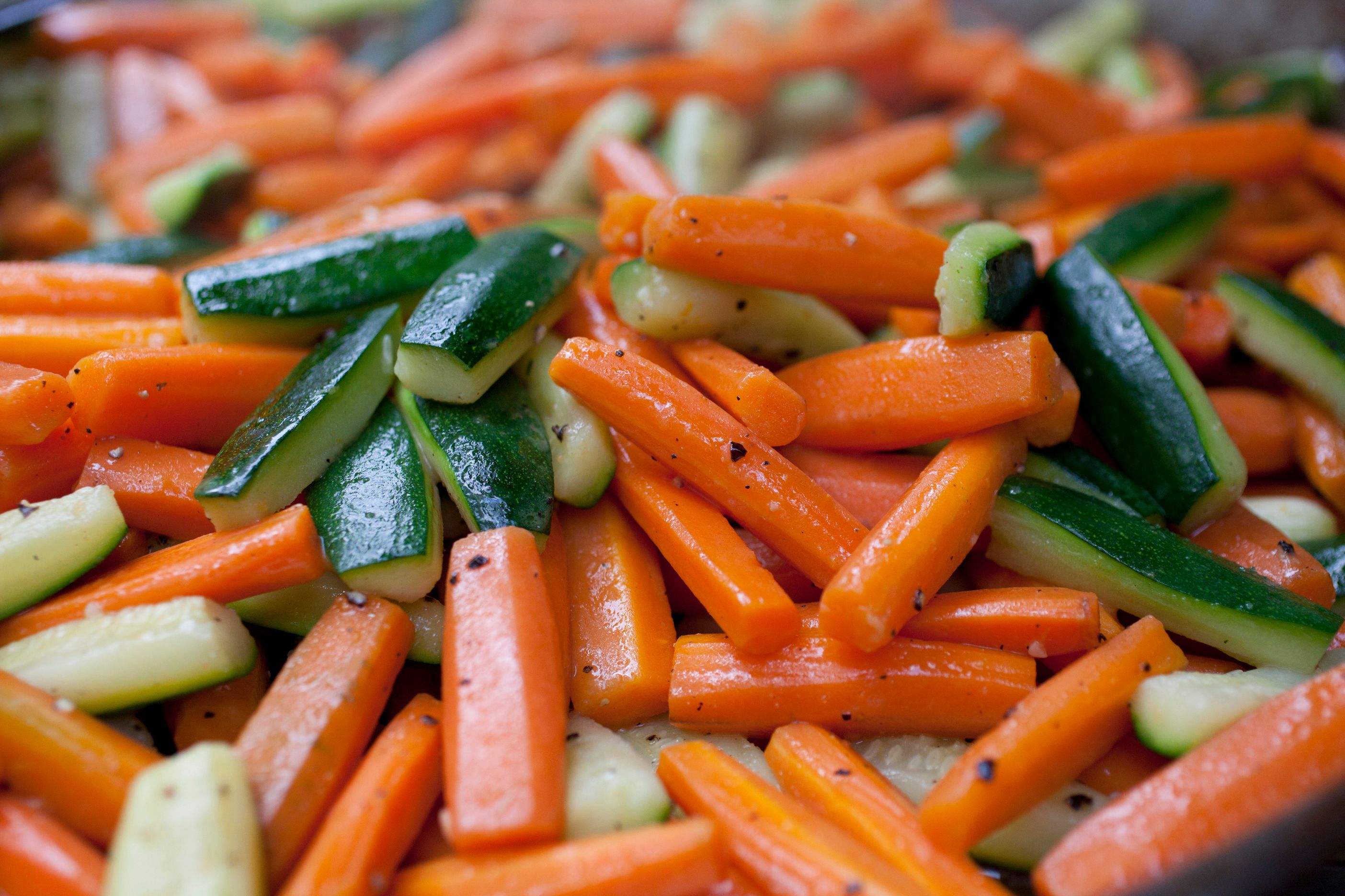 Close-up of roasted carrots and zucchinis.