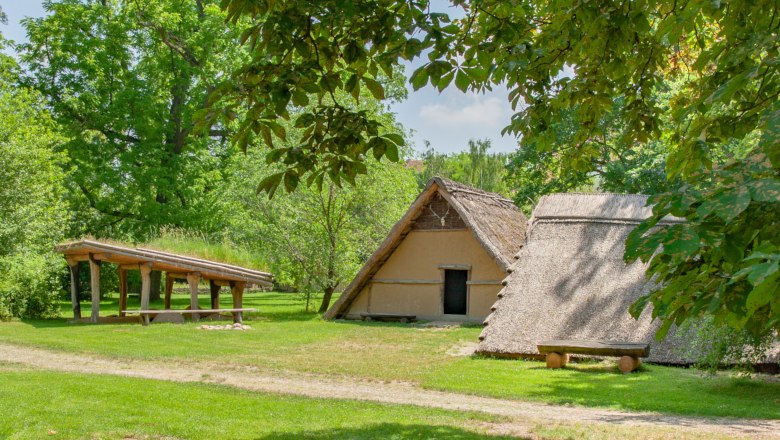 Reconstruction of prehistoric buildings in the MAMUZ open-air museum.